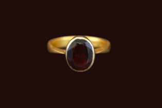 22ct Gold Rub over set Oval Almandine Garnet 2.9ct estimated weight. Size Q. 5.8g total weight