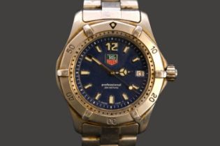 Tag Heuer Professional 200m Swiss quartz watch with date window & blue dial. 36mm case size.