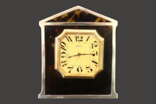 Tortoiseshell Silver mounted 8 Day easel clock with numeral dial Hallmarked London 1924. 10cm in