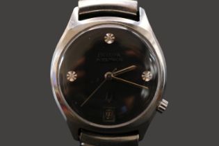 Bulova Accutron diamond set quartz watch with date window. 35mm case size.