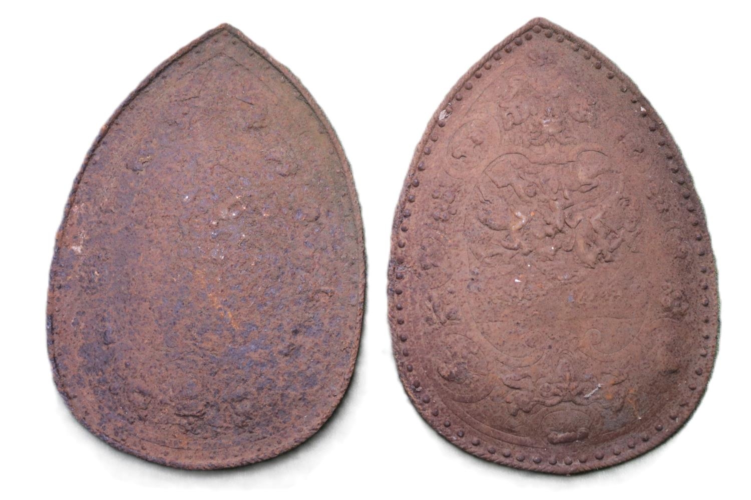 Pair of 19thC Germanic cast Iron shields in the Renaissance manner. The central oval medallion,