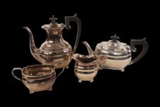 4 Piece Edwardian Silver Tea set with ebony handles and knops of panelled form supported on ball