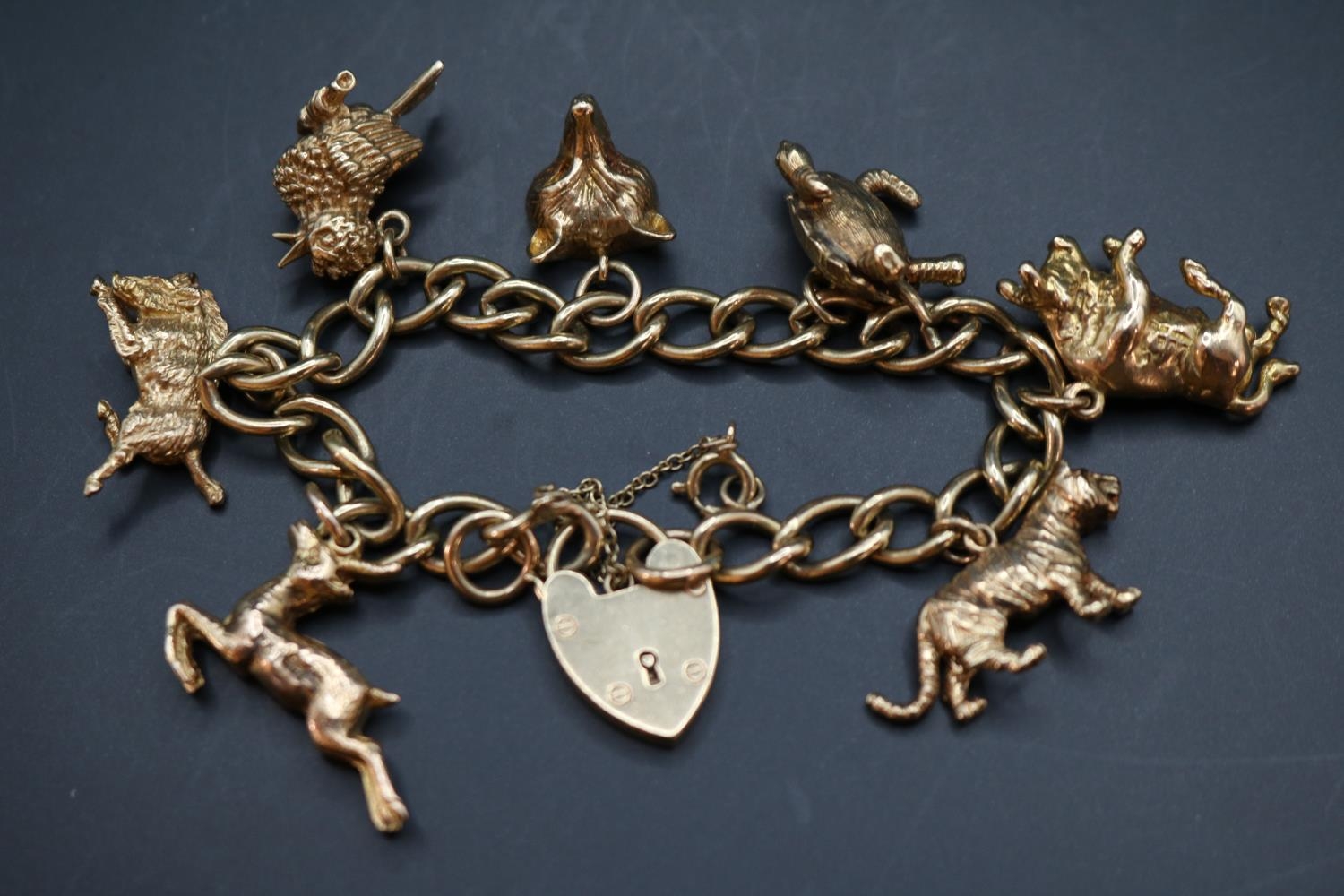 Early 20thC 9ct Gold Charm bracelet comprising of Seven charms to include Tiger, Bull, Turtle, - Image 2 of 2