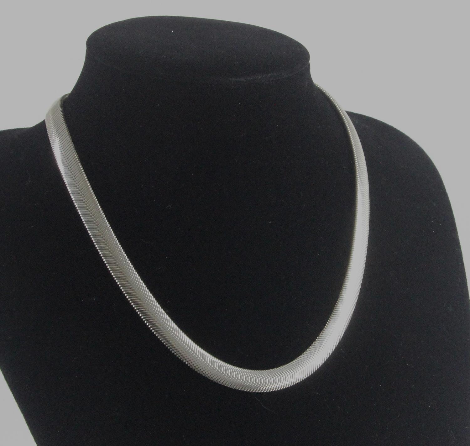 Solid silver herringbone design necklace 8mm wide, weighs 43.4gms with lobster clasp.