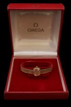 Omega Ladies 9ct Gold Cocktail wristwatch with baton dial, boxed with Guarantee booklet. 16.6g total