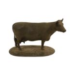 Early 20thC School Bronze Model of a Cow on oval base marked W M Chance. 24cm in Length