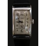 J W Benson of London Swiss Silver rectangular cased wristwatch on Leather strap. 24mm Case