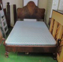 A mahogany double bed