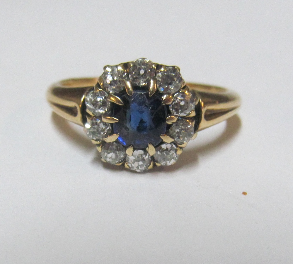 A sapphire and diamond cluster ring, size M/N 3.6g