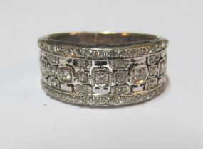 A diamond set band marked 750, size O 8g