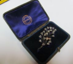 A leaf shaped diamond brooch in Hamilton & Co. Calcutta box