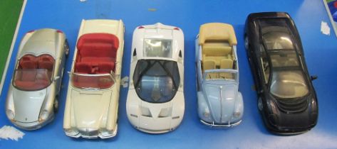 A Maisto convertible Beetle and four Maisto cars