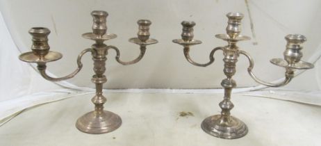 A pair silver three branch candelabra