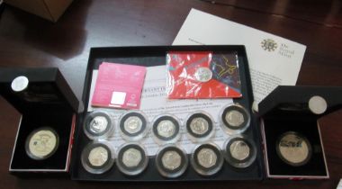 Some silver 2012 Olympic 50p coins and two Countdown to London 2012 coins