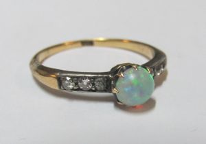 An 18ct opal and diamond ring, size O/P 2.2g