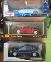 A Maisto Audi TT boxed, BMW M5 boxed and Wely Passat Sedan boxed