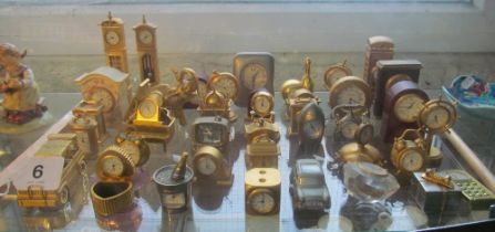 A group of novelty miniature clocks