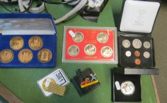 Various coins and a Guinness badge (including two copies of 1oz gold)