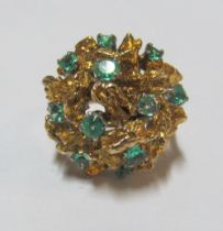 An emerald set dress ring marked 18k, size O 9.2g