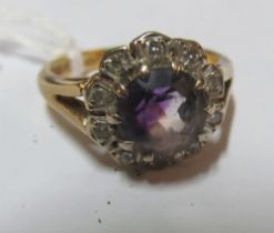 An 18ct amethyst and illusion diamond cluster ring, size O 5.4g