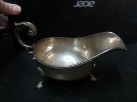 A silver sauceboat