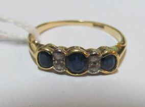 An 18ct sapphire and diamond ring, size Q/R 2.5g