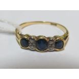 An 18ct sapphire and diamond ring, size Q/R 2.5g