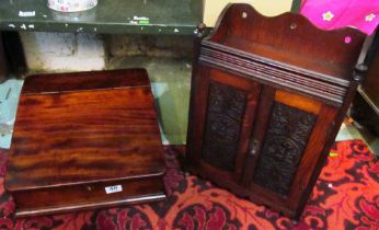 An Edwardian oak wall mounting smoker's cabinet, mahogany writing slope and a Shove Ha'penny board