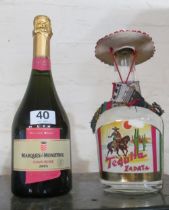 A bottle of Tequila and a bottle of 2005 Cava Rose