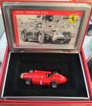 A boxed Ferrari D50 and group boxed and other cars