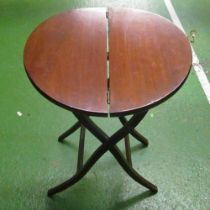 A mahogany folding coaching table