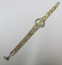 A ladies 18ct two coloured gold Longines wrist watch with diamond bezel