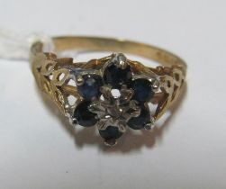 A 9ct flowerhead form sapphire and diamond ring, size N 1.8g