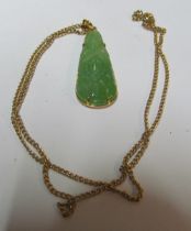 A jade pendant mount marked 18 on chain