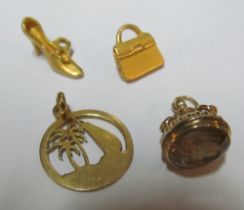 A pendant and three charms