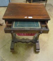 A 19th Century rosewood sewing/writing table the top drawer with leather writing slope and basket