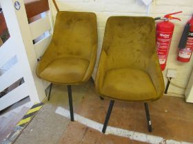 A pair of modern swivel chairs