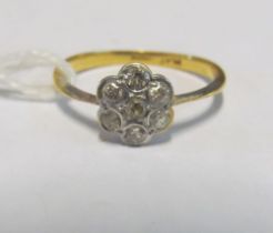 An 18ct and platinum small diamond cluster ring 1.6g size N/O