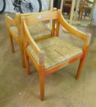 Two Vico Magistretti rush seated chairs (fades and cane a/f on 1)