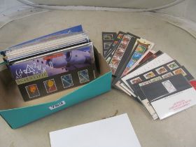 A collection of low value booklets of stamps in green shoe box