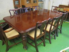 A mahogany dining table with leaf