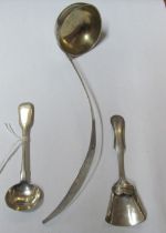 An Arabic white metal ladle, Dutch caddy spoon and Exeter silver salt spoon