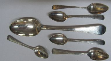 A Georgian silver tablespoon and five bright cut silver teaspoons 3.6oz