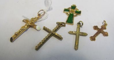 Two 9ct gold crosses and other crosses