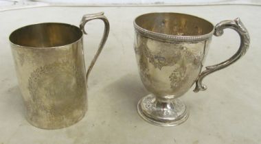 A Victorian silver christening cup 4.2oz and a Victorian cup with floral and swag embossed