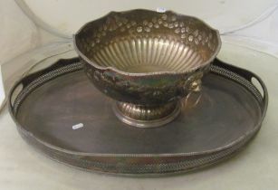 A large plated punch bowl and a tray