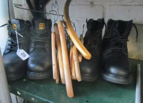 Two pairs men's Caterpillar black boots, size 9 and 10 and some wooden coathangers