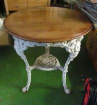 A Victorian Britannia cast iron pub table painted white with mahogany top