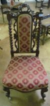 A Victorian chair with barleytwist supports