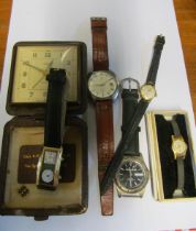 Two gold coloured ladies watches, three other watches and an alarm clock